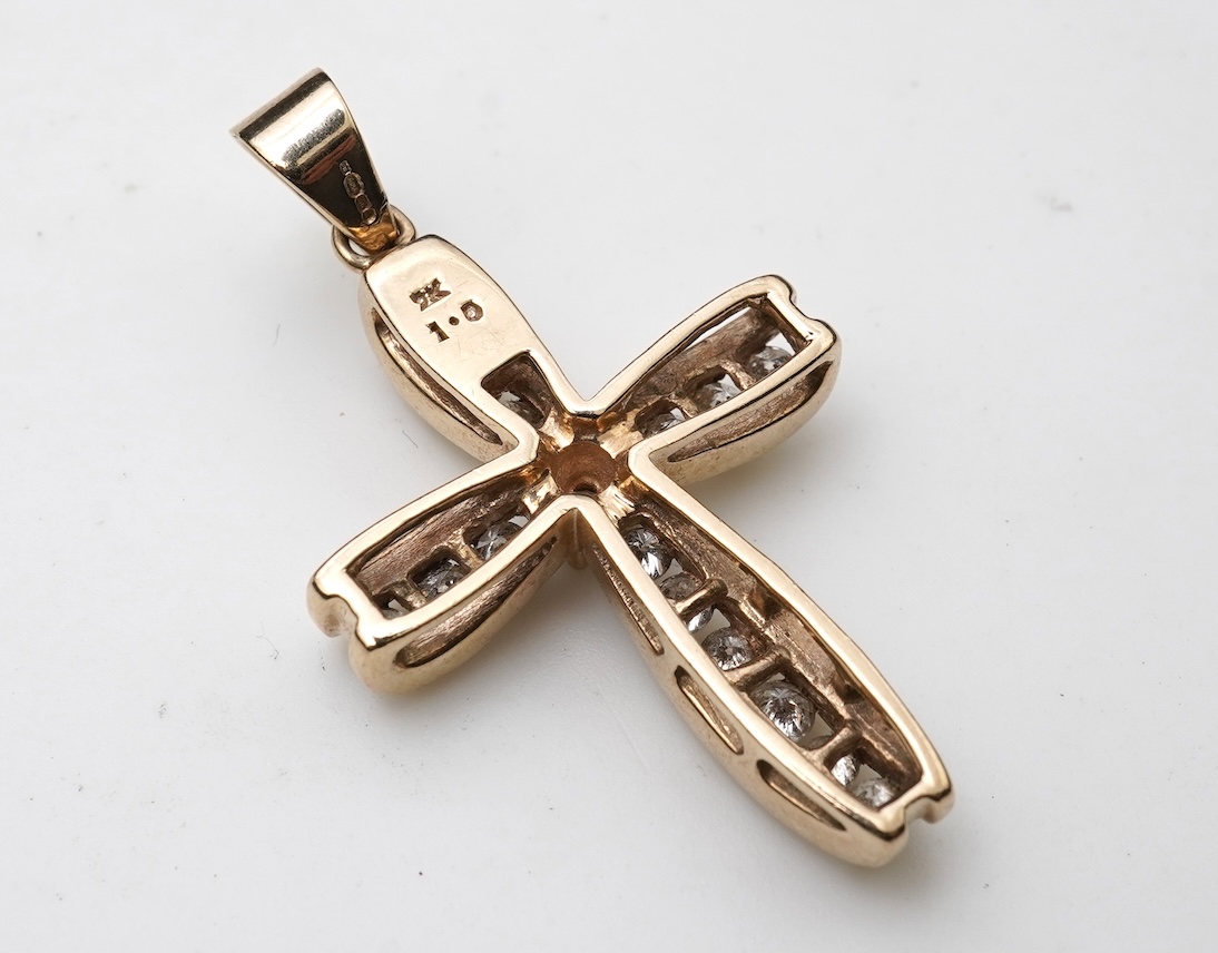 A diamond cross pendant